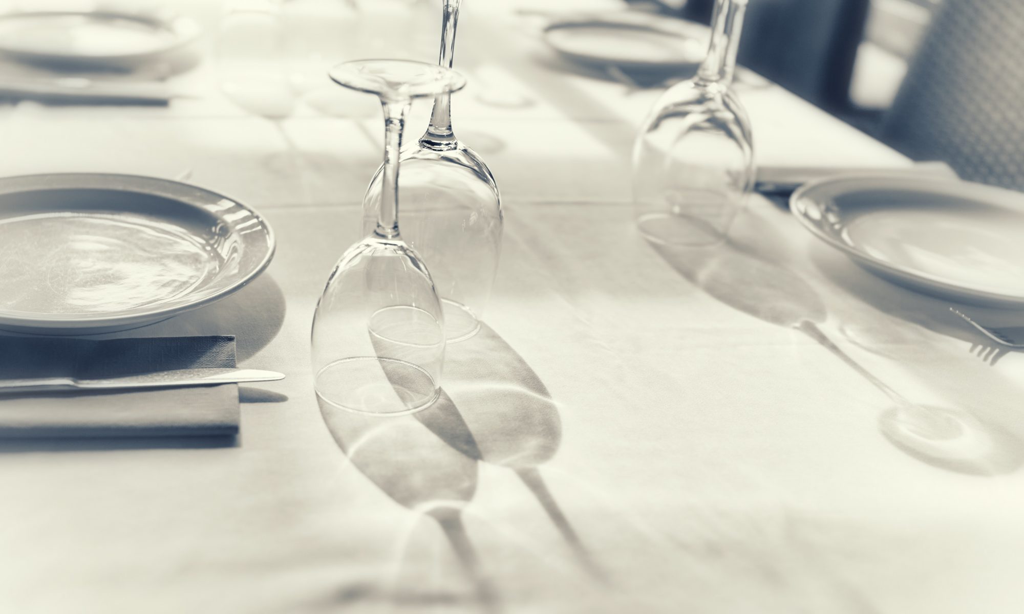 Table set with plates and glasses.