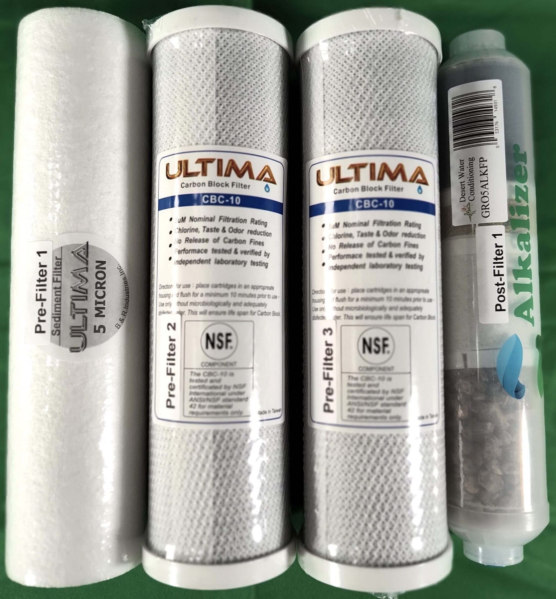 Water filter cartridges on a green background.